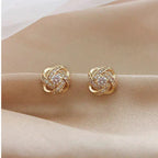Pendientes Dorados Espiral Floral con Cristales